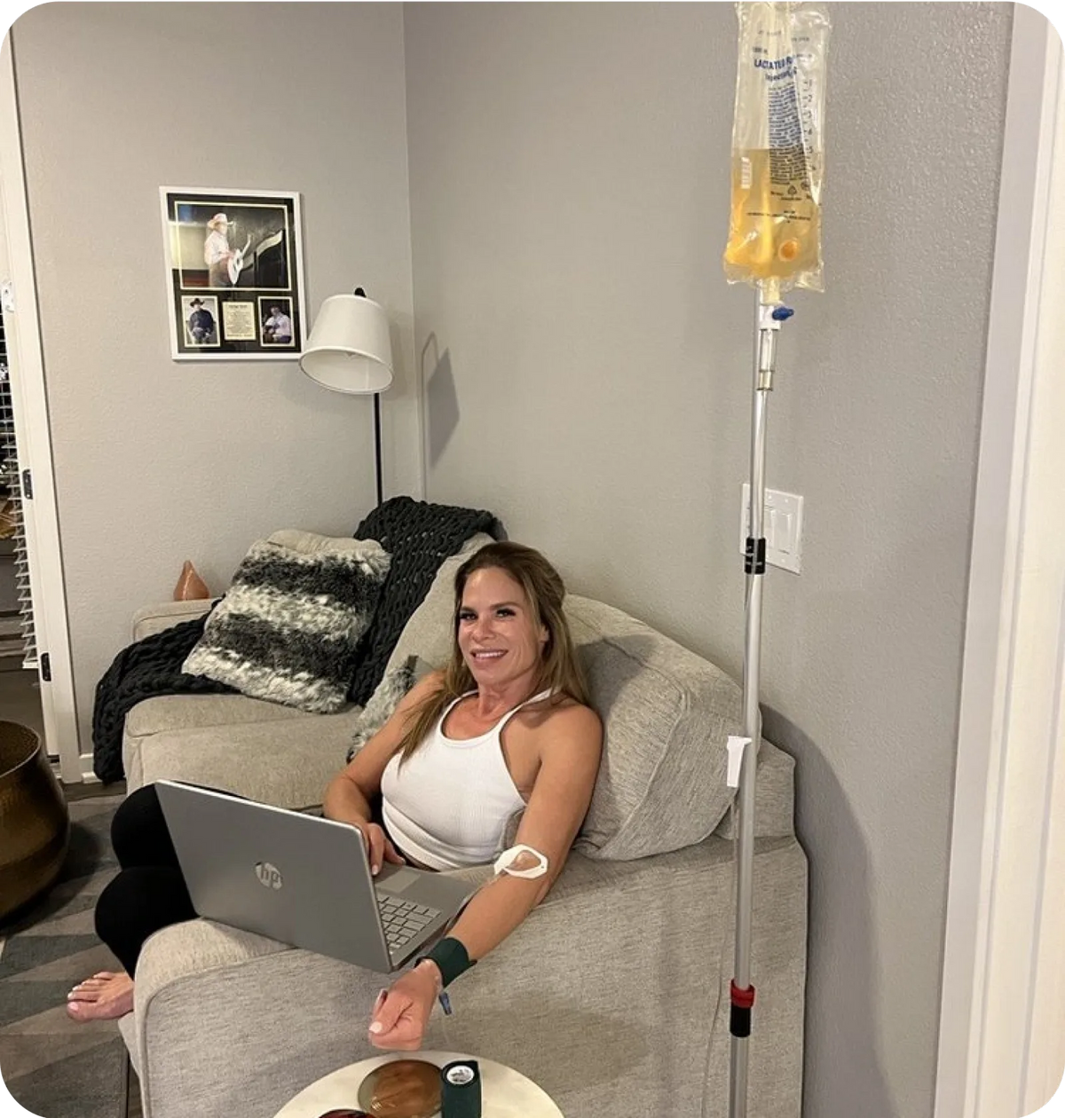 AZ IV Medics provider monitoring a NAD+ IV infusion during a private mobile appointment