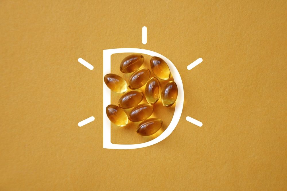 Vitamin D pills inside a white letter