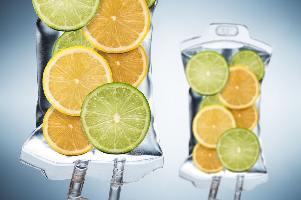 IV bags filled with citrus fruit slices, lemons and limes.
