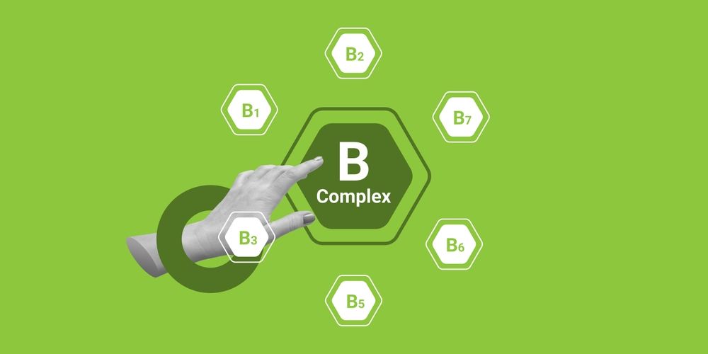 Hand interacting with a B-Complex diagram, highlighting the different B vitamins on a green background.