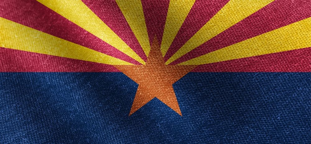 Arizona state flag with star and sunburst design.