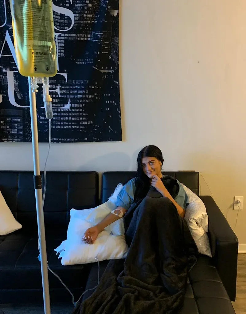 Client receiving mobile IV therapy in a private Scottsdale hotel-style room
