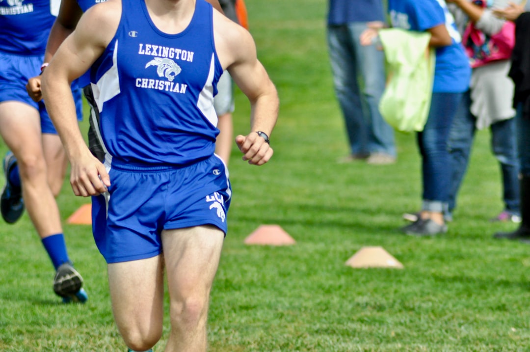 A runner in a blue uniform with the words