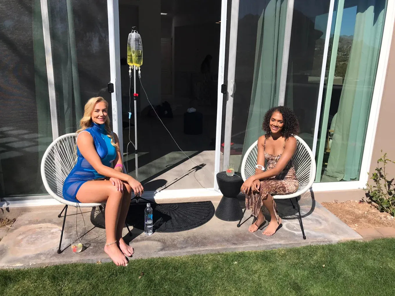 Two clients receiving mobile IV therapy from AZ IV Medics on an Arizona patio